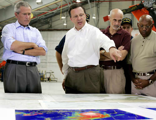 Jim Watson/Getty Images. FEMA Director Michael Brown explains Katrina situation to President George W. Bush and Homeland Security Secretary Michael Chertoff 