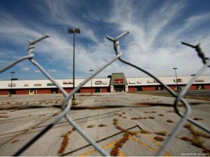A vacant strip mall. Photo by Gerald Herbert, AP. 