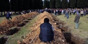 Graves dug for dead miners at a mass burial site in Soma.