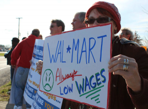 Walmart workers picket for higher pay. 