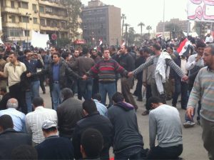 Christians protecting Muslims in Tahrir Square, 2011.