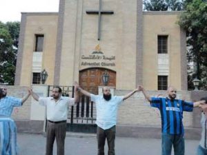 Egyptian Muslims shield Adventist Church after attack by extremists.