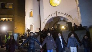 Muslims form a shield in front of a synagogue in Norway.