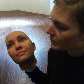 Heather Dewey-Hagborg contemplates her own face, created from DNA she extracted from a strand of her hair.