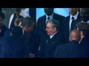 President Obama shakes hands with Raul Castro at Nelson Mandela’s memorial.