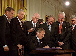 President Bush signs in the Patriot Act in October 2001. Photo credit: Wikimedia Foundation 