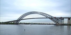 The Bayonne Bridge spans the waterway linking New Jersey with Staten Island, a site that remains radioactive today. Photo credit: Raymond Bucko, SJ / Flickr