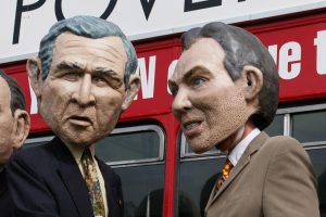Protesters wearing George W. Bush and Tony Blair disguises. Photo credit:  Tintazul / Wikimedia (CC BY 2.0)