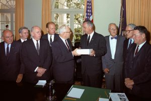 Members of the Warren Commission present their report on the assassination of President John F. Kennedy to President Lyndon Johnson. Cabinet Room, White House, Washington DC. L-R: John McCloy, J. Lee Rankin (General Counsel), Senator Richard Russell, Congressman Gerald Ford, Chief Justice Earl Warren, President Lyndon B. Johnson, Allen Dulles, Senator John Sherman Cooper, and Congressman Hale Boggs Photo credit:  Cecil Stoughton / White House / Wikimedia