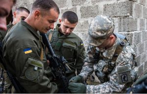 US military advisers will start training six battalions of the Ukrainian Armed Forces on November 23, Ukrainian Presidential Administration spokesman Andriy Lysenko said Saturday. About this photo: US Army Sgt. with Ukrainian National Guard soldiers. Photo Credit: US Army