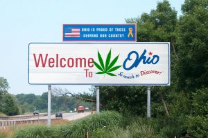 Ohio will decide the fate of legal weed today. Photo Credit: Adapted by WhoWhatWhy from Ohio Sign (bearclau / Flickr [CC BY 2.0]) and Cannabis leaf (Oren neu dag / Wikimedia [CC BY-SA 3.0])