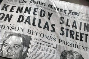 Kennedy slain on Dallas street November 23, 1963 — paper re-published  on plastic bag. Photo credit: Grant Laird Jr / Flickr (CC BY 2.0)
