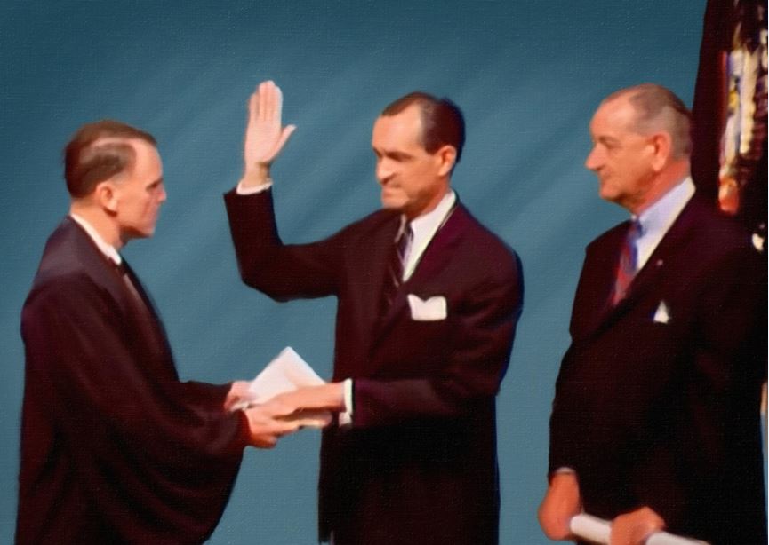Richard Helms takes an oath at the his swearing in ceremony as Director of Intelligence. Photo credit: Adapted by WhoWhatWhy from (Jesse Wilinski / YouTube)
