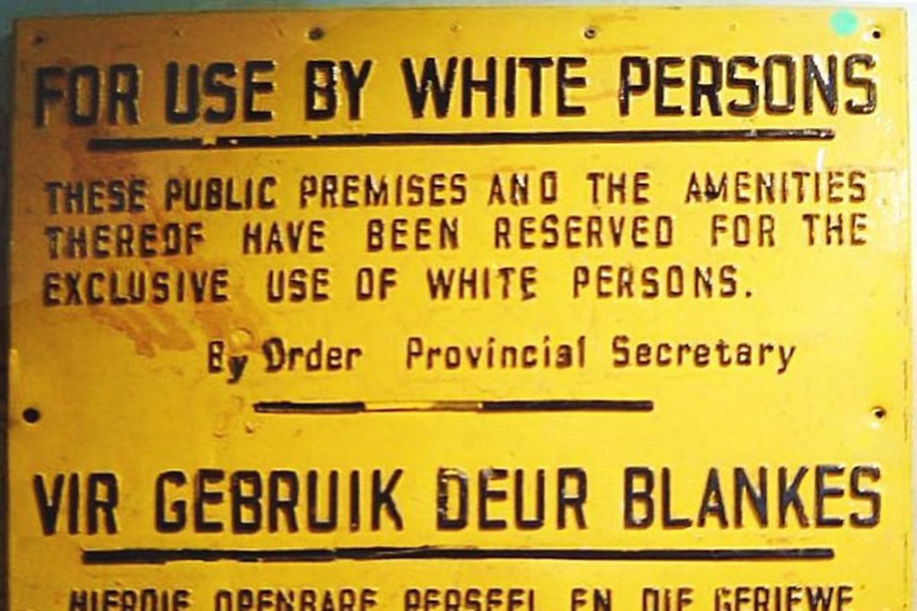 Sign from the Apartheid era in South Africa. Photo credit: Dewet / Wikimedia (cropped) 