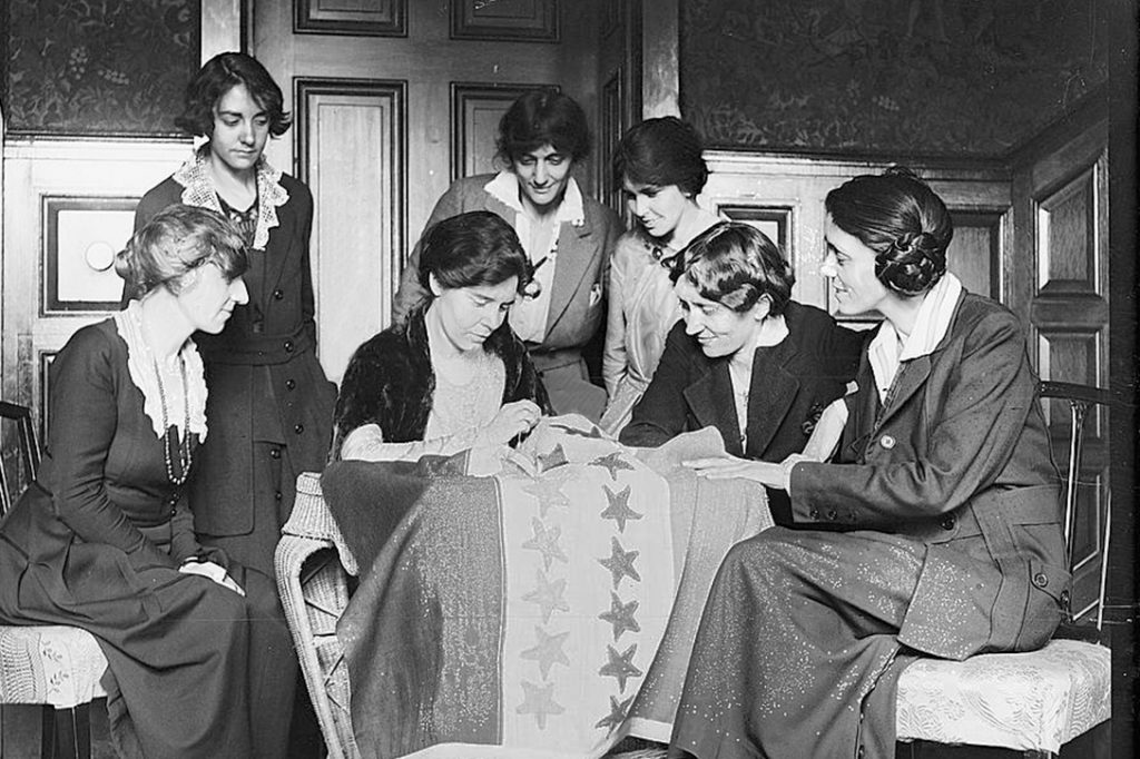 women, sewing, suffrage flag