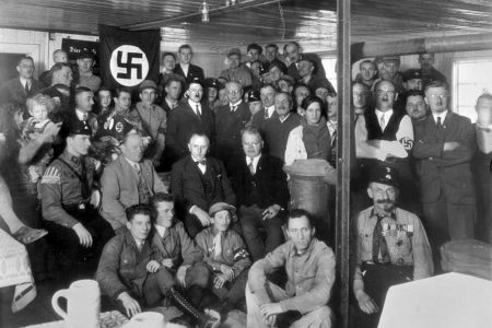 Adolf Hitler with Nazi Party members in 1930