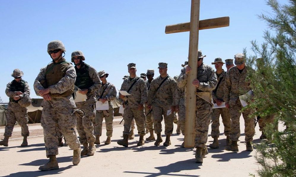 Soldiers carrying cross