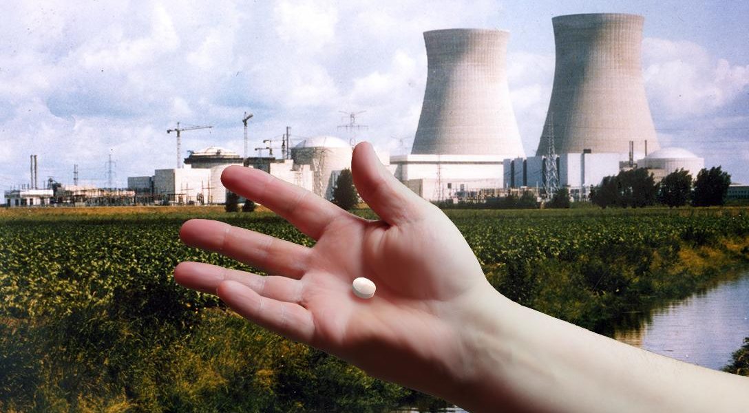 Doel nuclear plant, Belgium, hand, pill