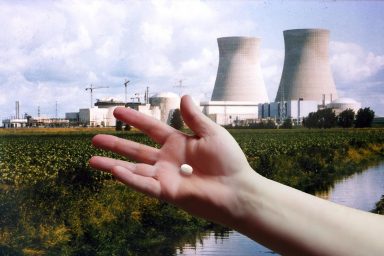 Doel nuclear plant, Belgium, hand, pill