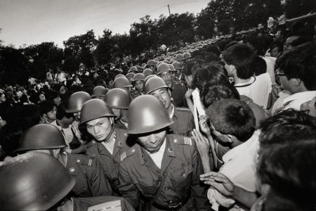 Chinese troops march into Tiananmen Square