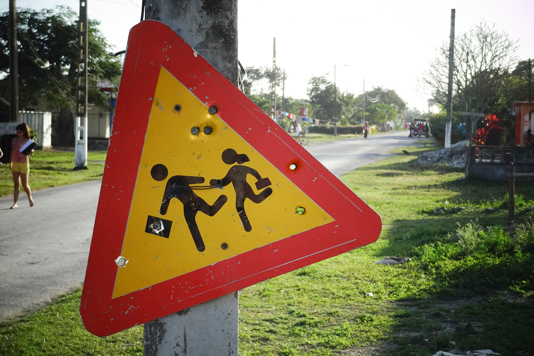 school safety, sign, bullet holes
