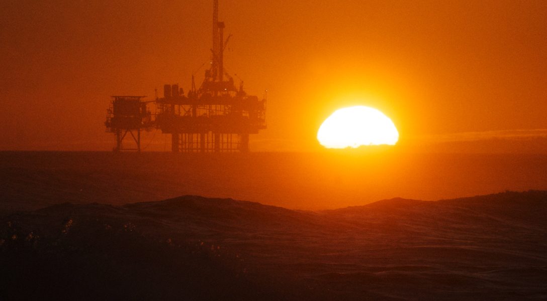 Sunset over oil rig off Huntington Beach, California