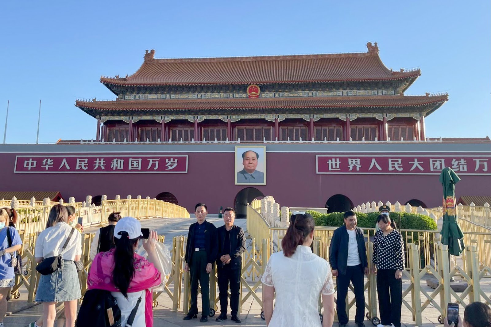 Tourists posing at Tiananmen Square
