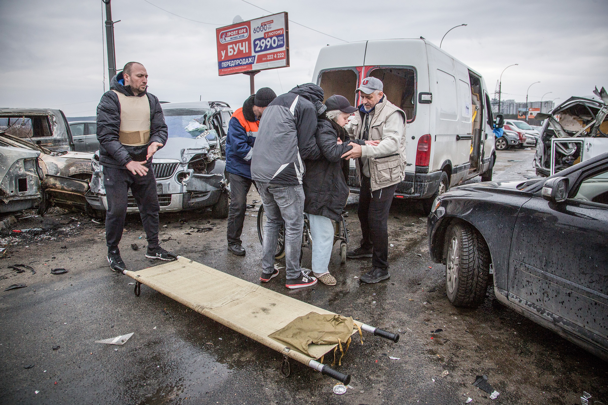 Ukraine, displaced, soldier, dog, stretcher, wrecked vehicles