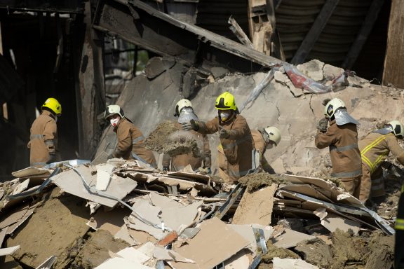 Firefighters remove debris, Kremenchuk