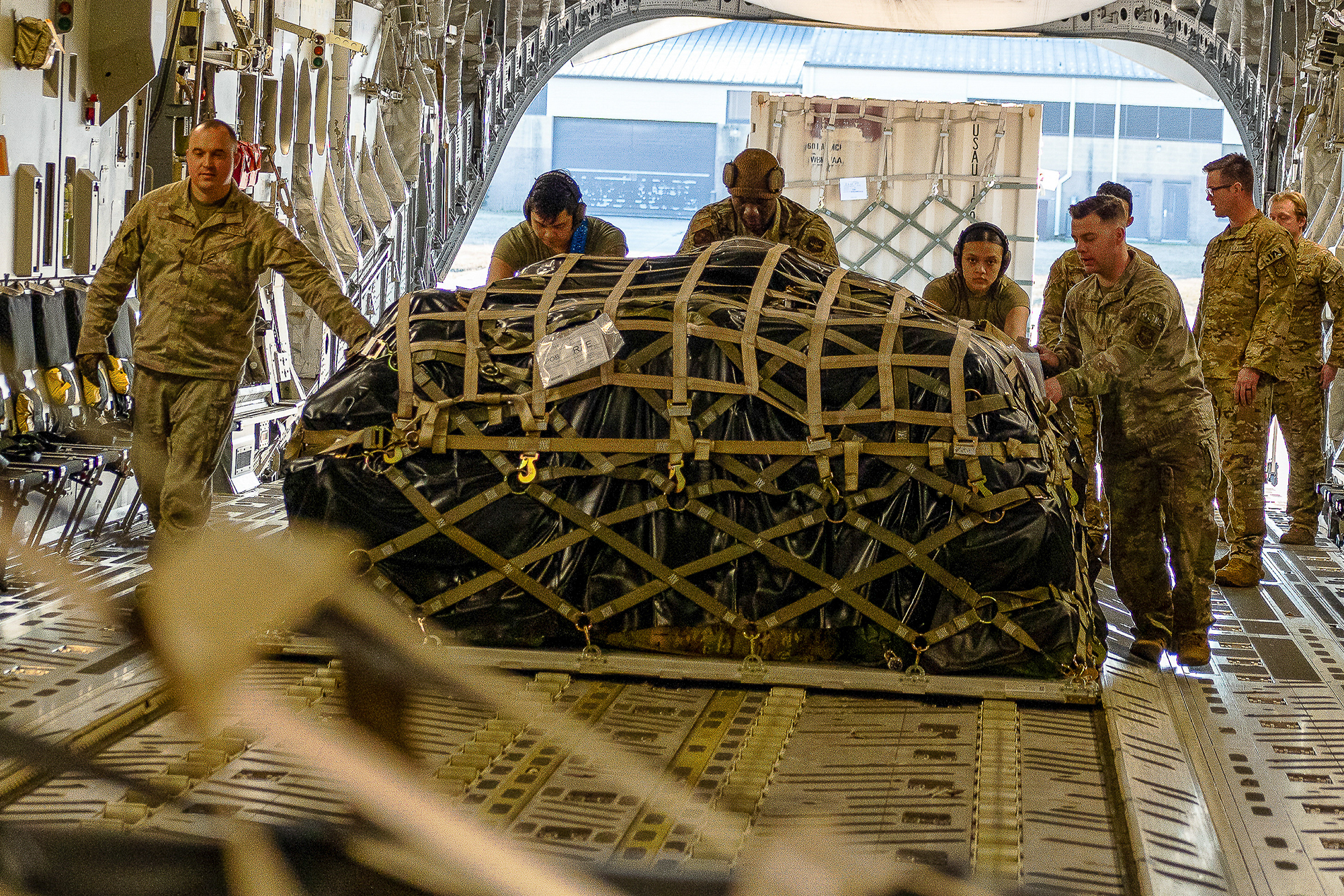 Air Force, airmen, load cargo on a C-17