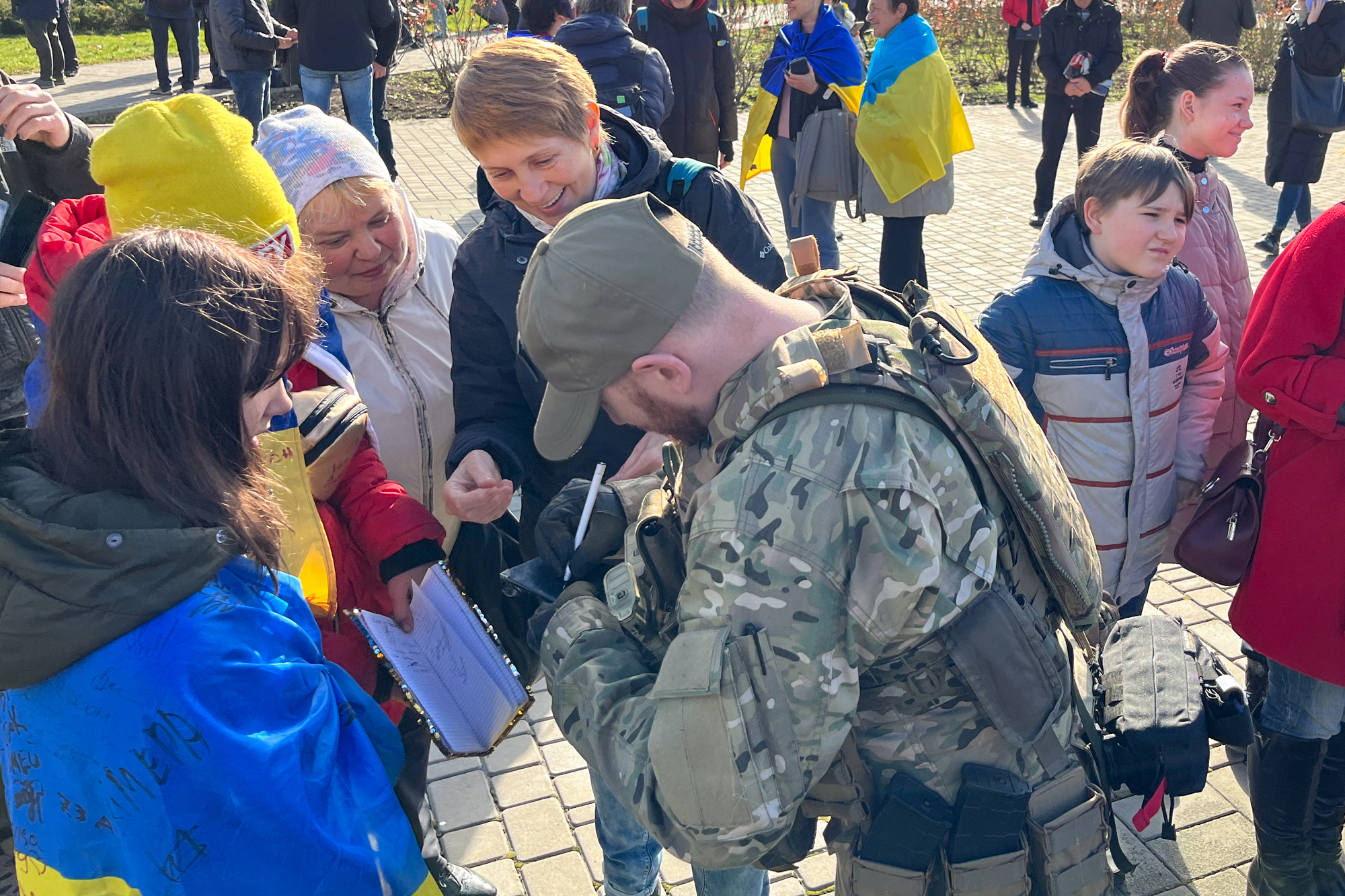 Soldier signing autographs, Kherson, Ukraine