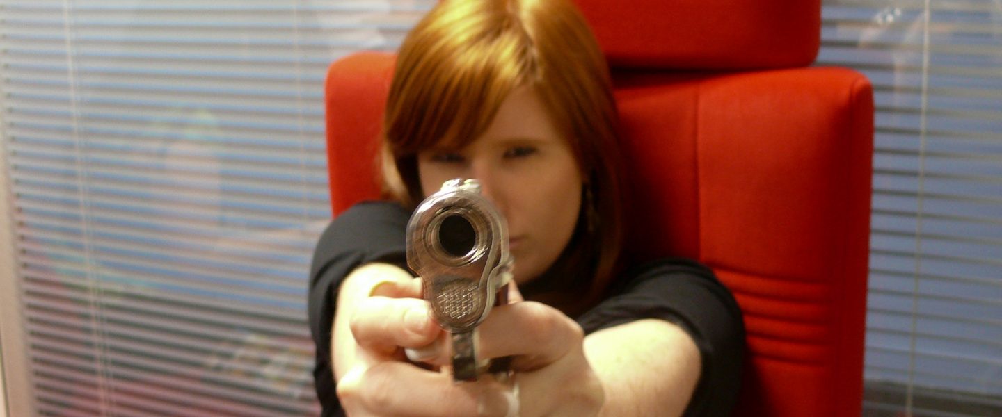 Woman pointing handgun