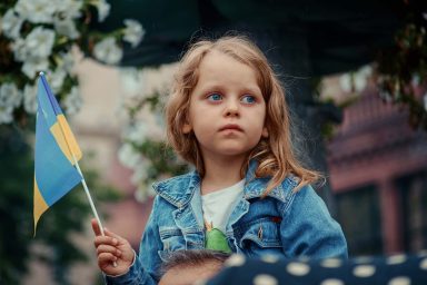 Ukrainian child, holding flag