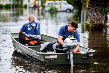 climate crisis, South Florida storm, foot of rain, flooding, power outages