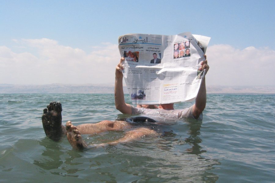 Man reading news,Dead Sea.