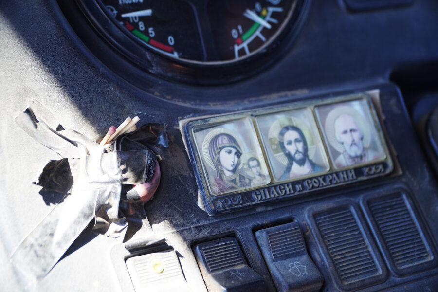 Religious icons, tractor dashboard. 