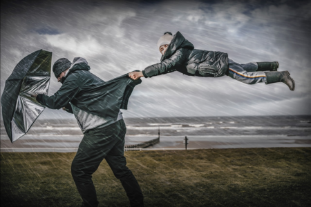 child hanging on, man, windstorm