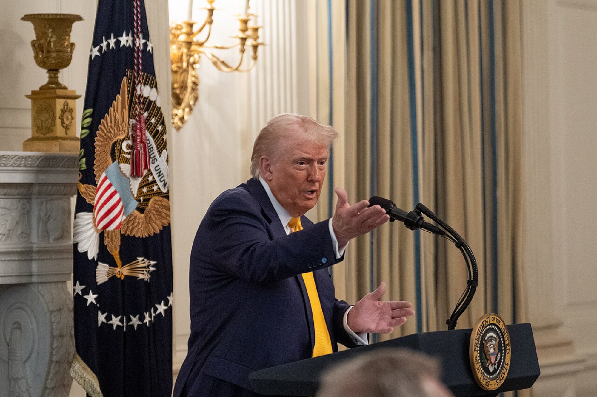 President Donald Trump, speaking, podium