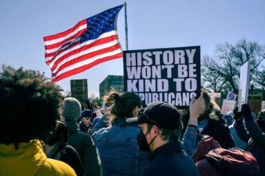 Protest sign states, History Won't Be Kind to Republicans, No Kings Day Protest