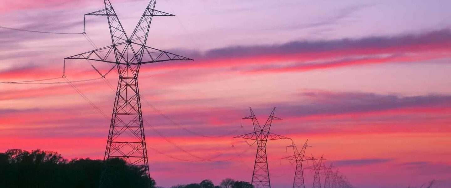 Transmission towers, lines, sunset, East Texas