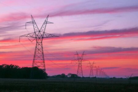 Transmission towers, lines, sunset, East Texas