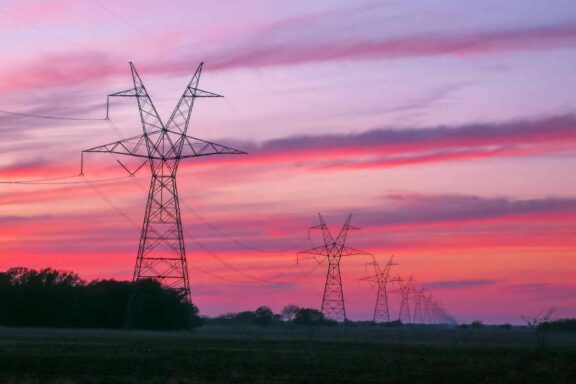 Transmission towers, lines, sunset, East Texas