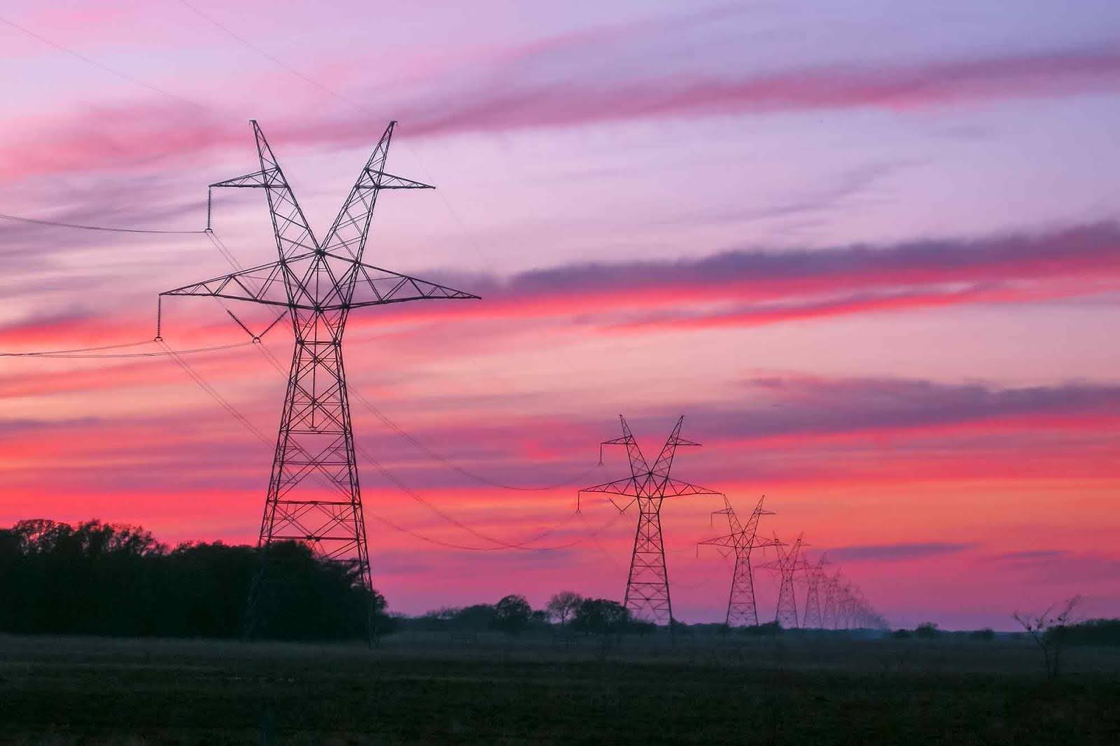 Transmission towers, lines, sunset, East Texas