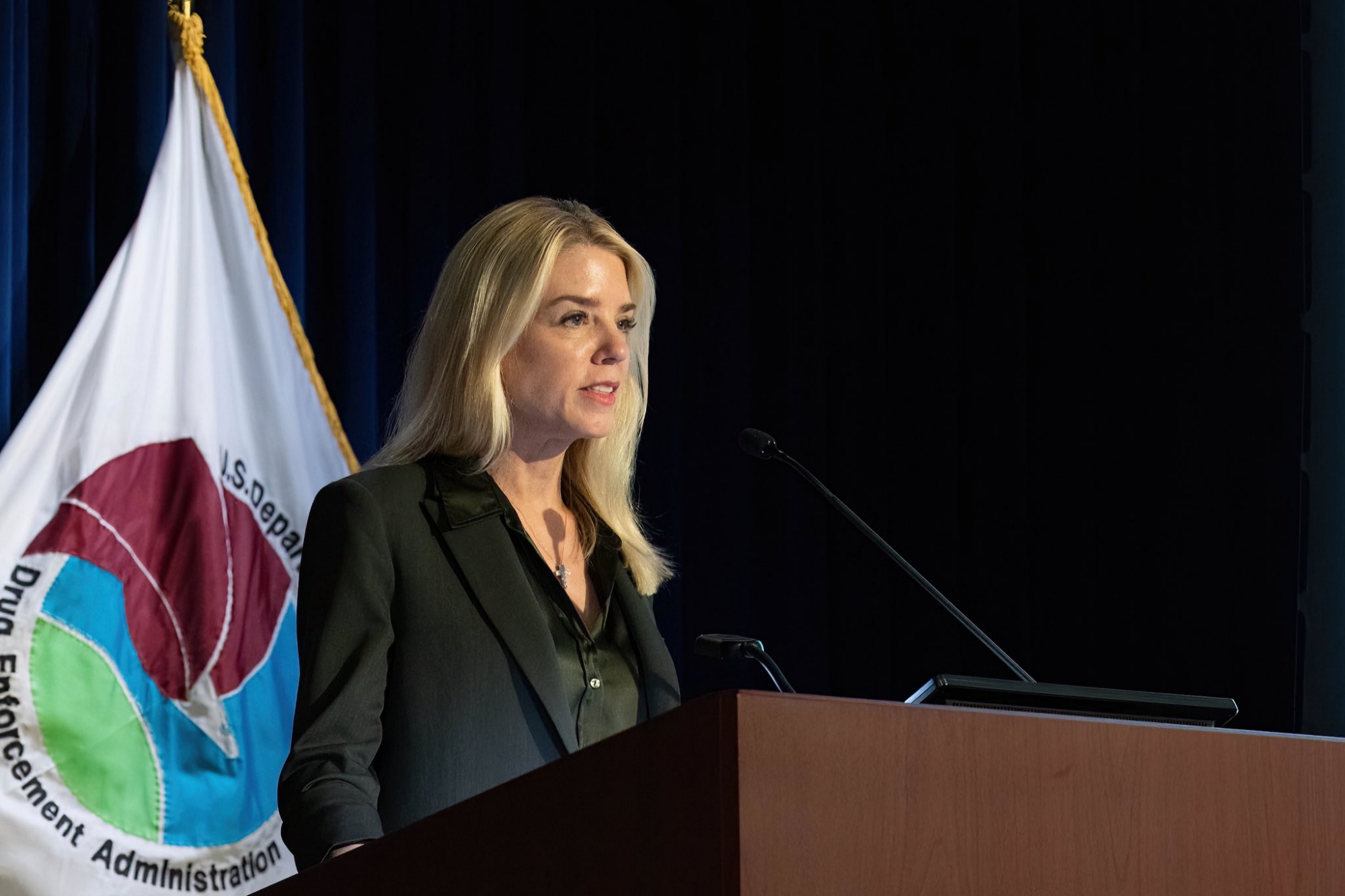 Pam Bondi, podium, speaking