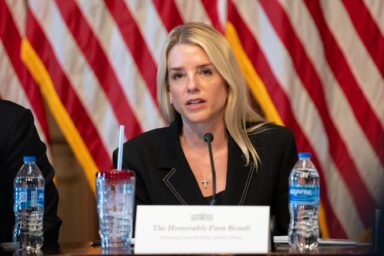 Pam Bondi, podium, speaking