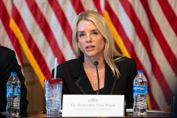 Pam Bondi, podium, speaking