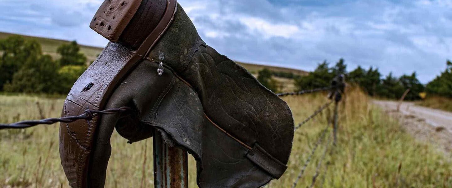 cowboy boot, fence post