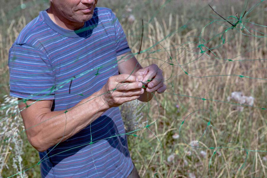 Andriy_Threading_Fishing_Nets_Donbas_3x2.jpg