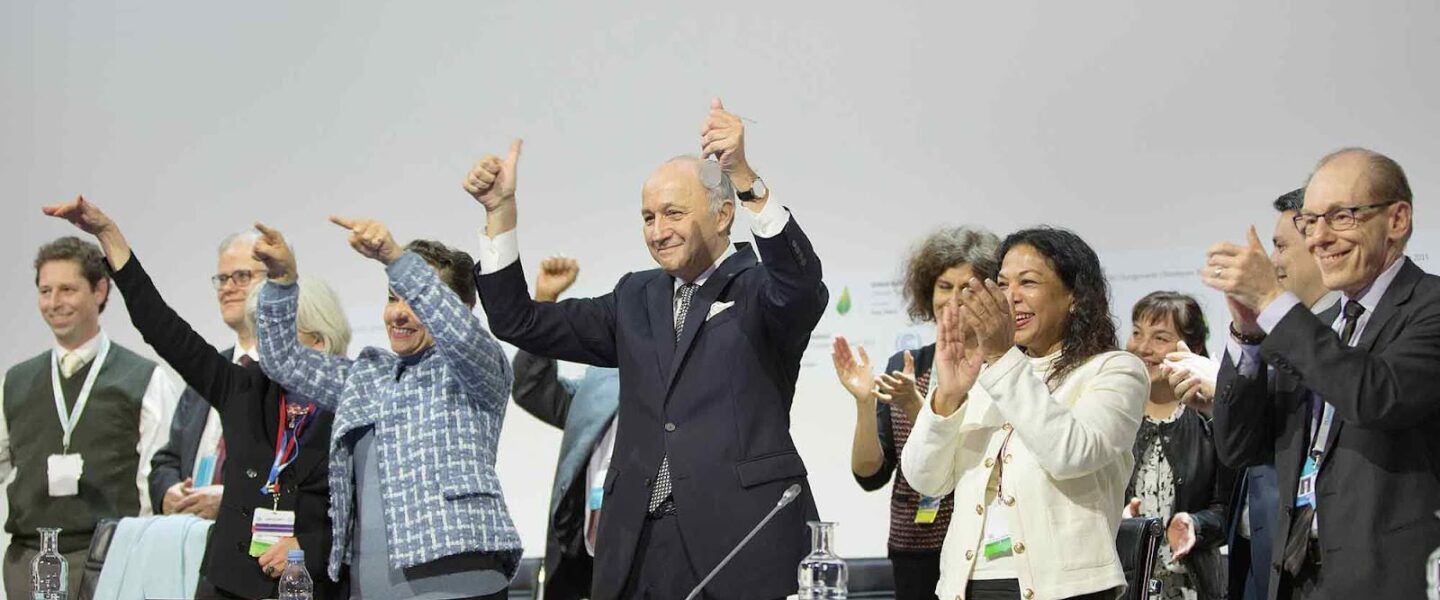 UN delegates, celebrate, Paris Agreement, Climate Change Conference, 2015