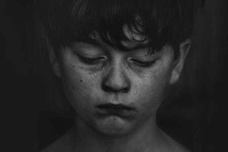 Grieving, adolescent, boy, tears